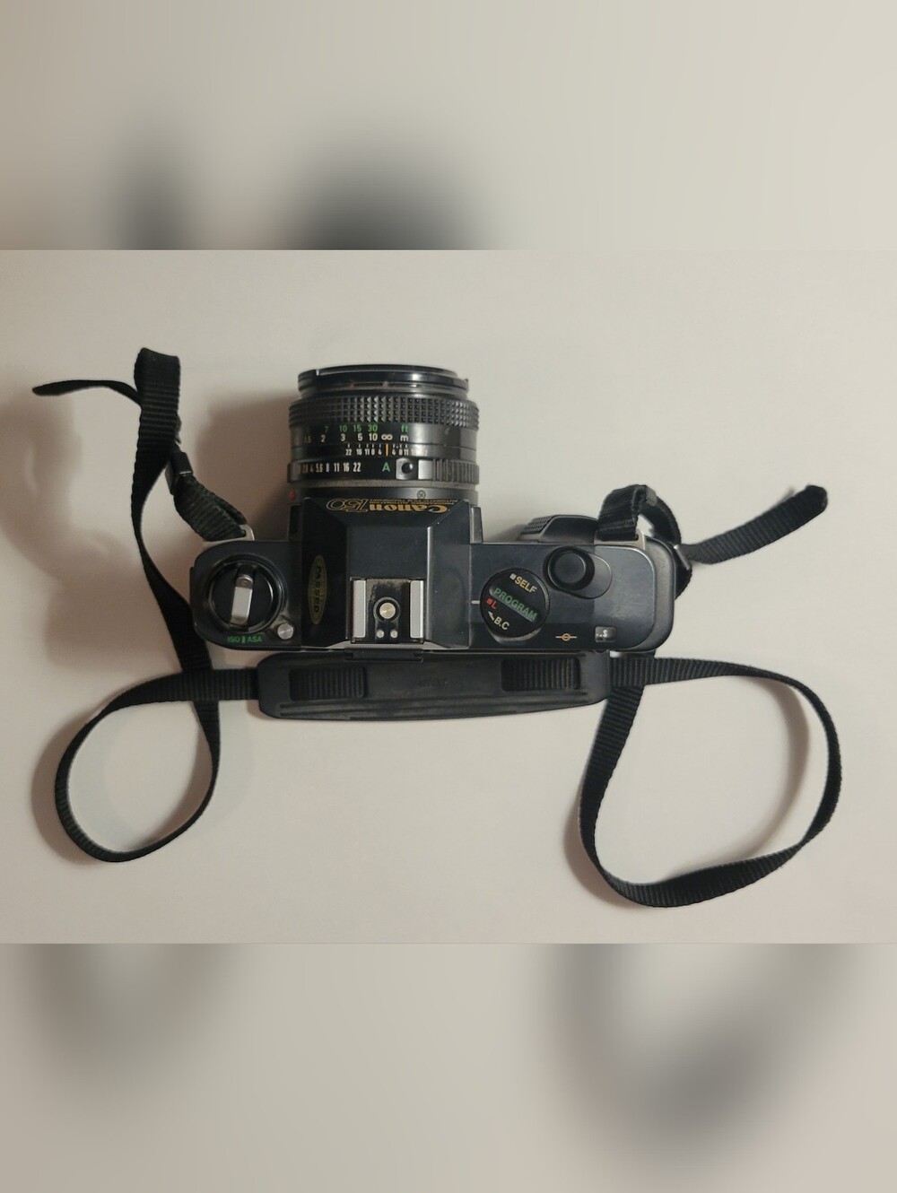 Canon black film camera with 50mm FD f/1.8 lens and neck strap - Picture 2 of 6